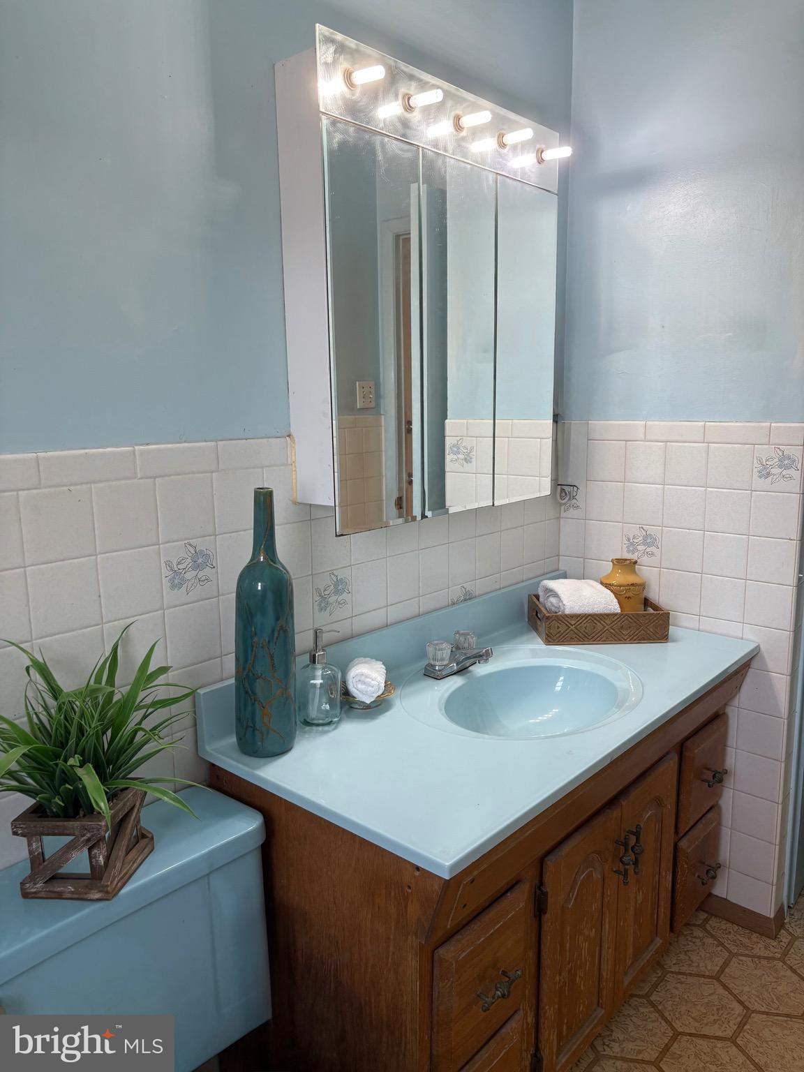 146 Ewingville Road Ewing, NJ 08638 - Photo 4 of 7 a bathroom with a sink and a mirror