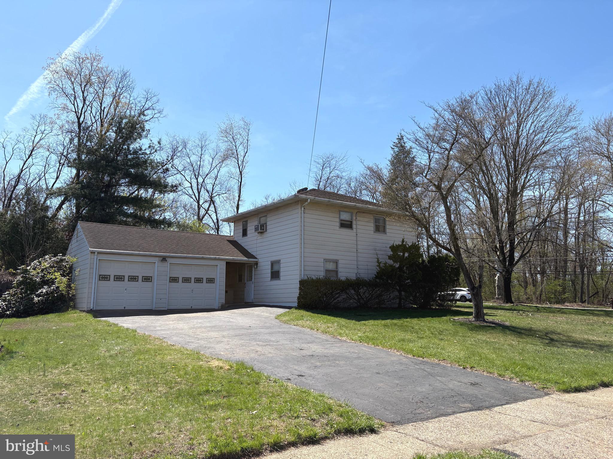 146 Ewingville Road Ewing, NJ 08638 - Photo 6 of 7 a front view of a house with a yard and trees