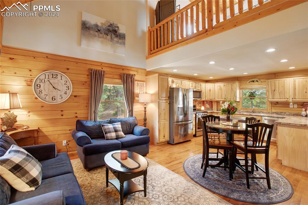 143 Wahsatch Road Florissant, CO 80816 - Photo 12 of 50 a living room with furniture a clock and a large window