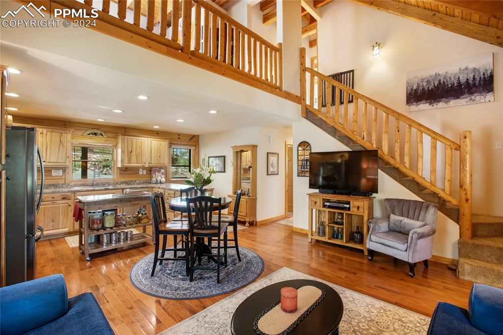 143 Wahsatch Road Florissant, CO 80816 - Photo 13 of 50 a living room with furniture kitchen view and a wooden floor