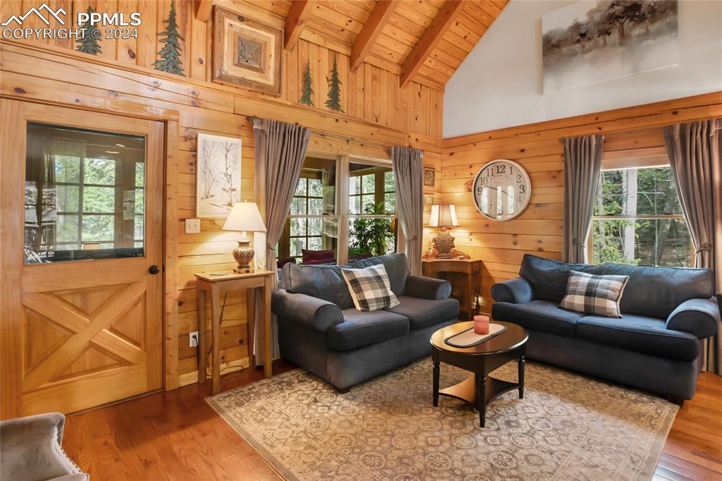 143 Wahsatch Road Florissant, CO 80816 - Photo 14 of 50 a living room with fireplace furniture and a large window