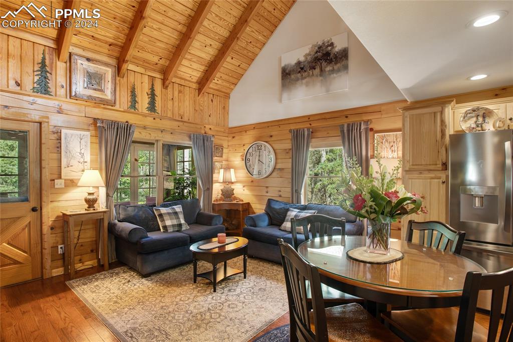 143 Wahsatch Road Florissant, CO 80816 - Photo 20 of 50 a living room with furniture a large window and a dining table
