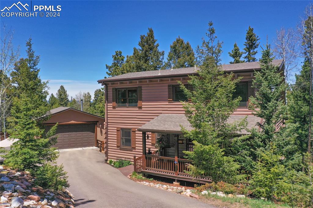 143 Wahsatch Road Florissant, CO 80816 - Photo 2 of 50 a view of a house with a yard and tree s