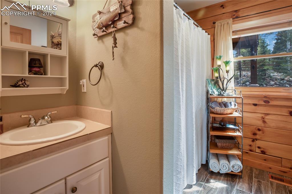 143 Wahsatch Road Florissant, CO 80816 - Photo 28 of 50 a bathroom with a sink and a mirror