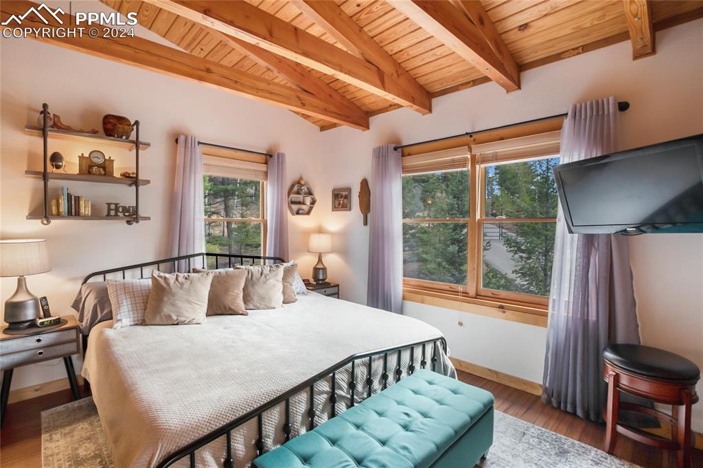 143 Wahsatch Road Florissant, CO 80816 - Photo 29 of 50 a bedroom with furniture and a large window