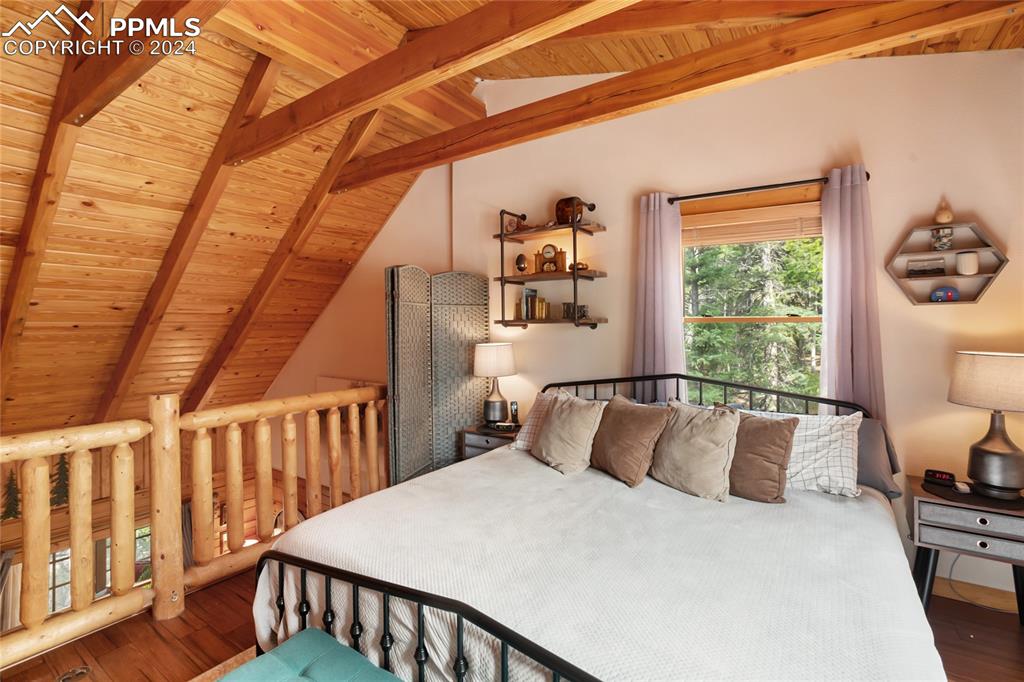 143 Wahsatch Road Florissant, CO 80816 - Photo 30 of 50 a bedroom with a bed and a window