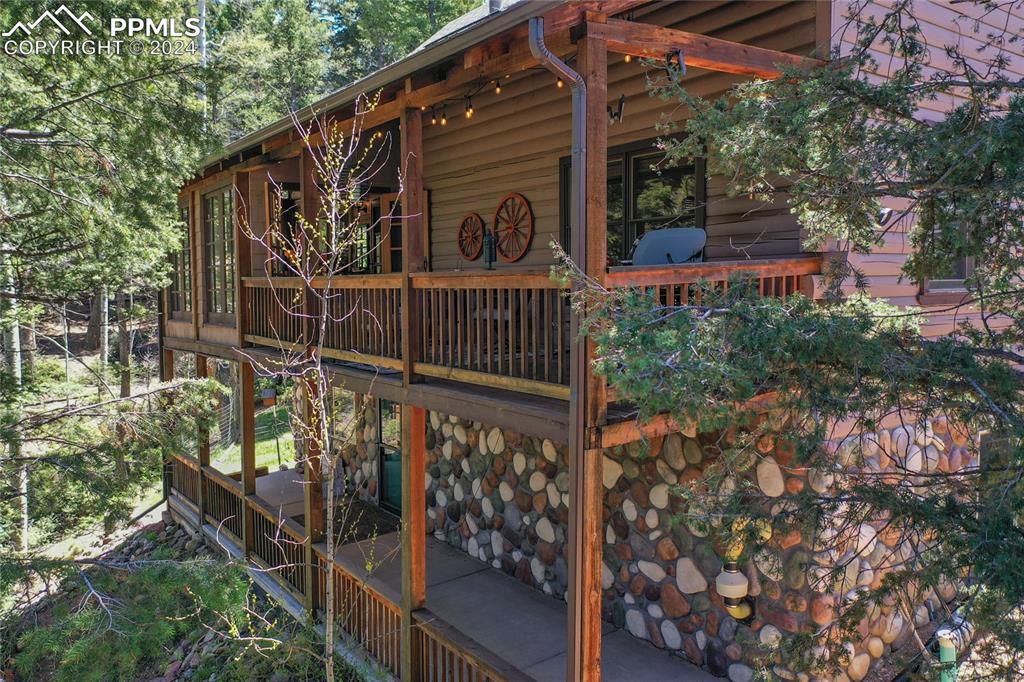 143 Wahsatch Road Florissant, CO 80816 - Photo 4 of 50 a view of street along with trees