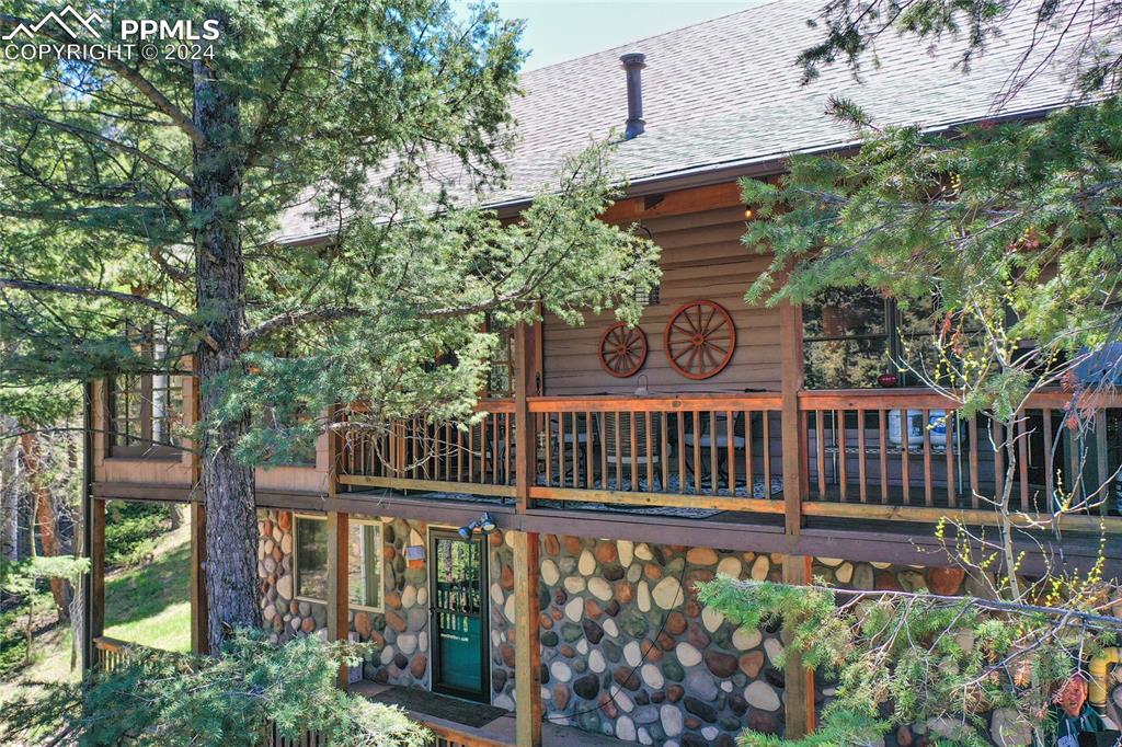 143 Wahsatch Road Florissant, CO 80816 - Photo 48 of 50 a view of a wooden deck with a small yard