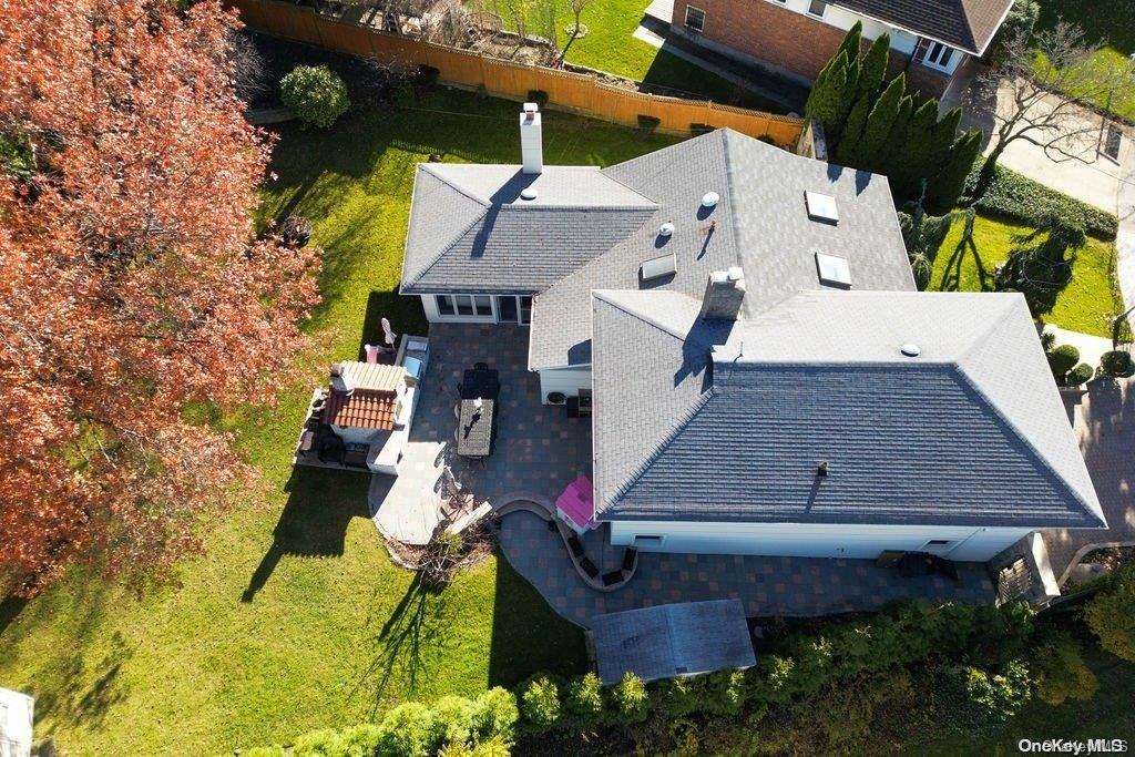 228-22 49th Road Queens, NY 11364 - Photo 1 of 1 an aerial view of a house with swimming pool and large trees
