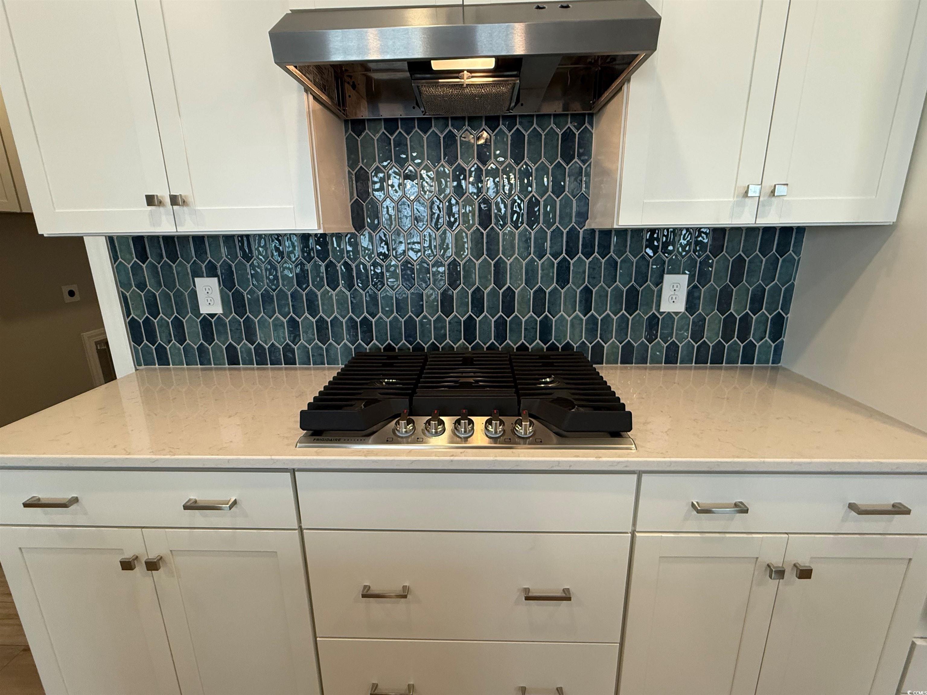 4024 Bucolic Loop Myrtle Beach, SC 29588 - Photo 3 of 29 Kitchen with decorative backsplash, white cabinetr