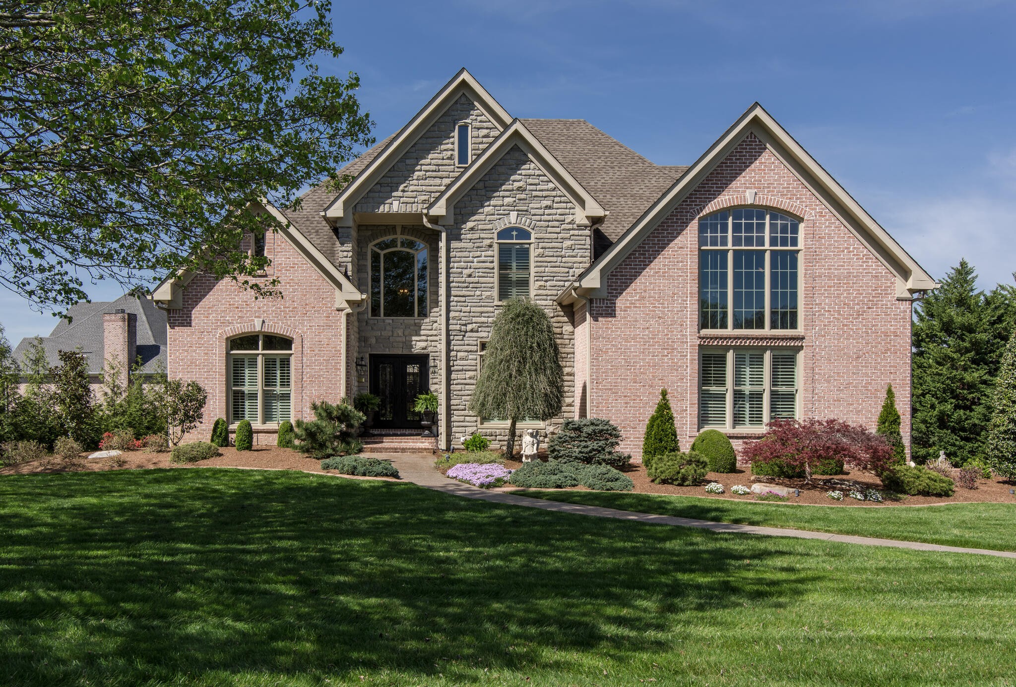 1101 Sunset Road Brentwood, TN 37027 - Photo 1 of 40 a front view of house with yard and green space