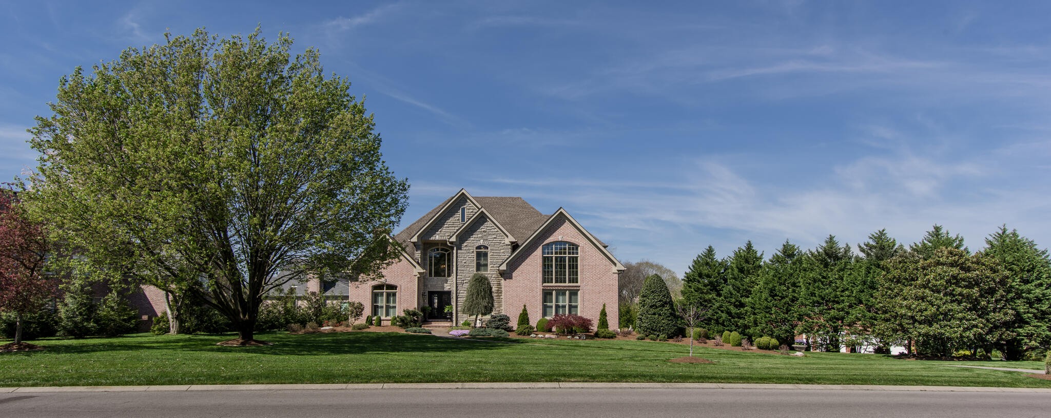1101 Sunset Road Brentwood, TN 37027 - Photo 2 of 40 a front view of a building with trees