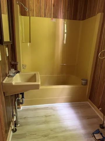 a bathroom with a sink and a mirror