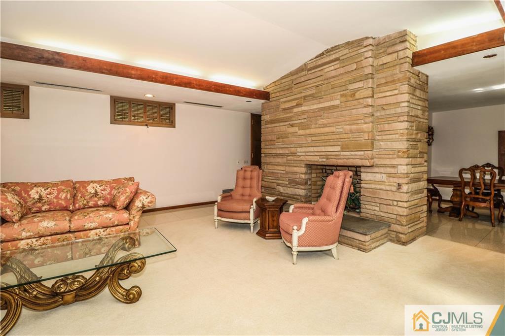 45 Sherwood Road Colonia, NJ 07067 - Photo 13 of 25 a reading room with furniture and a chair