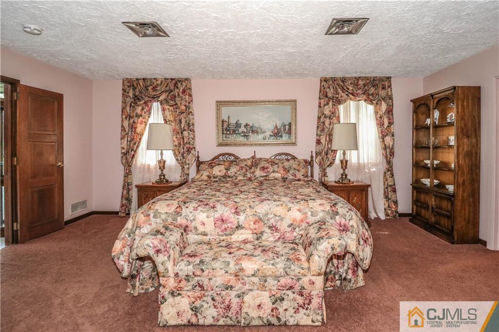 45 Sherwood Road Colonia, NJ 07067 - Photo 14 of 25 a bedroom with a large bed and a window