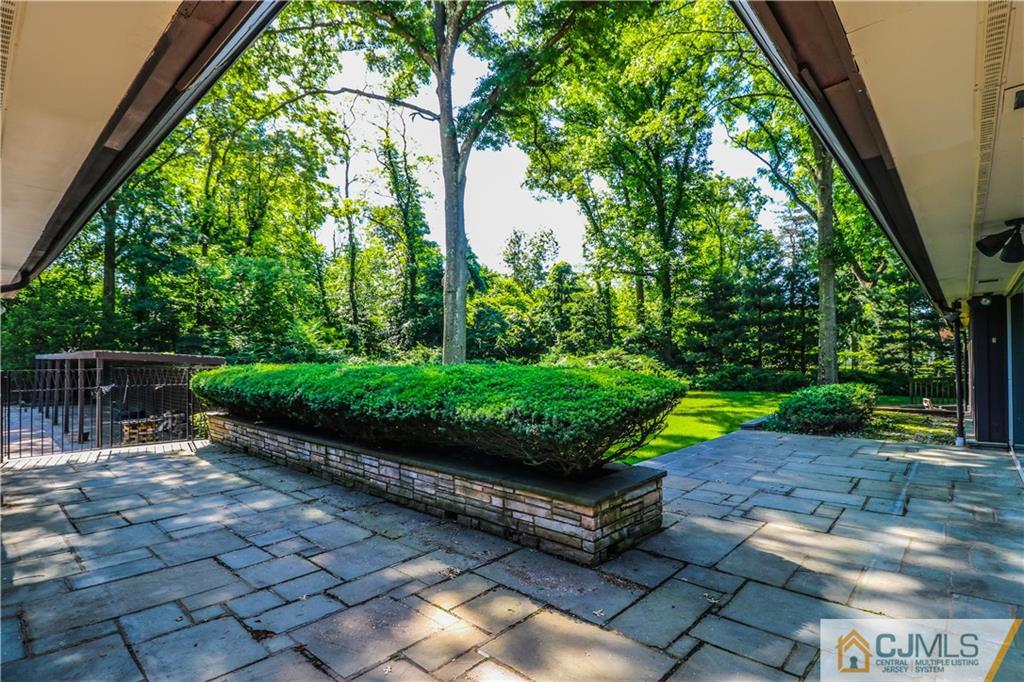 45 Sherwood Road Colonia, NJ 07067 - Photo 21 of 25 a view of a garden with wooden fence