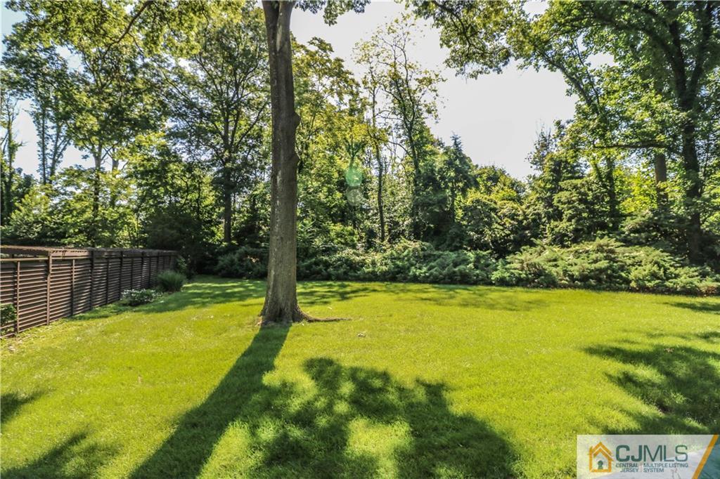 45 Sherwood Road Colonia, NJ 07067 - Photo 22 of 25 a view of a swimming pool with an outdoor space and seating area