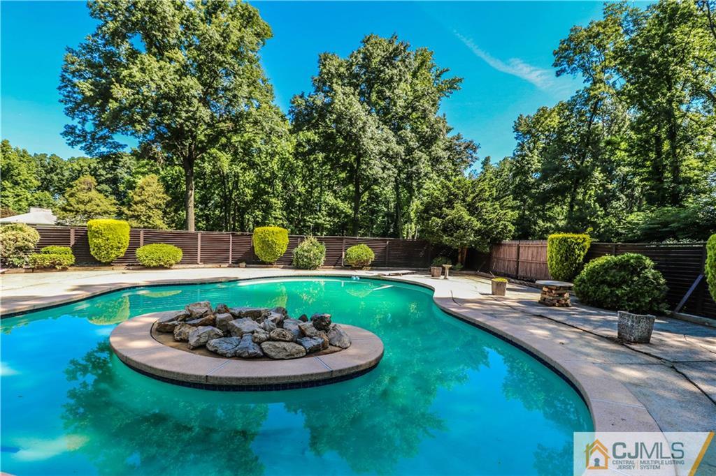 45 Sherwood Road Colonia, NJ 07067 - Photo 23 of 25 a view of a backyard with swimming pool