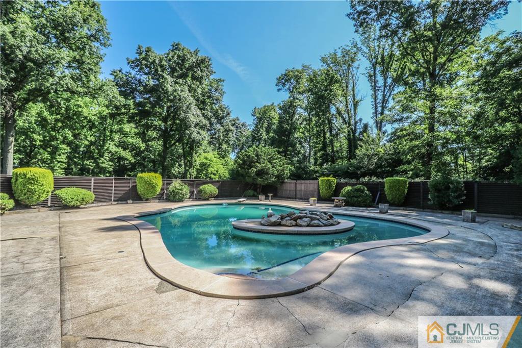 45 Sherwood Road Colonia, NJ 07067 - Photo 24 of 25 a view of a backyard with plants and trees