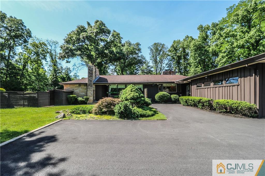 45 Sherwood Road Colonia, NJ 07067 - Photo 25 of 25 a front view of a house with a yard and potted plants