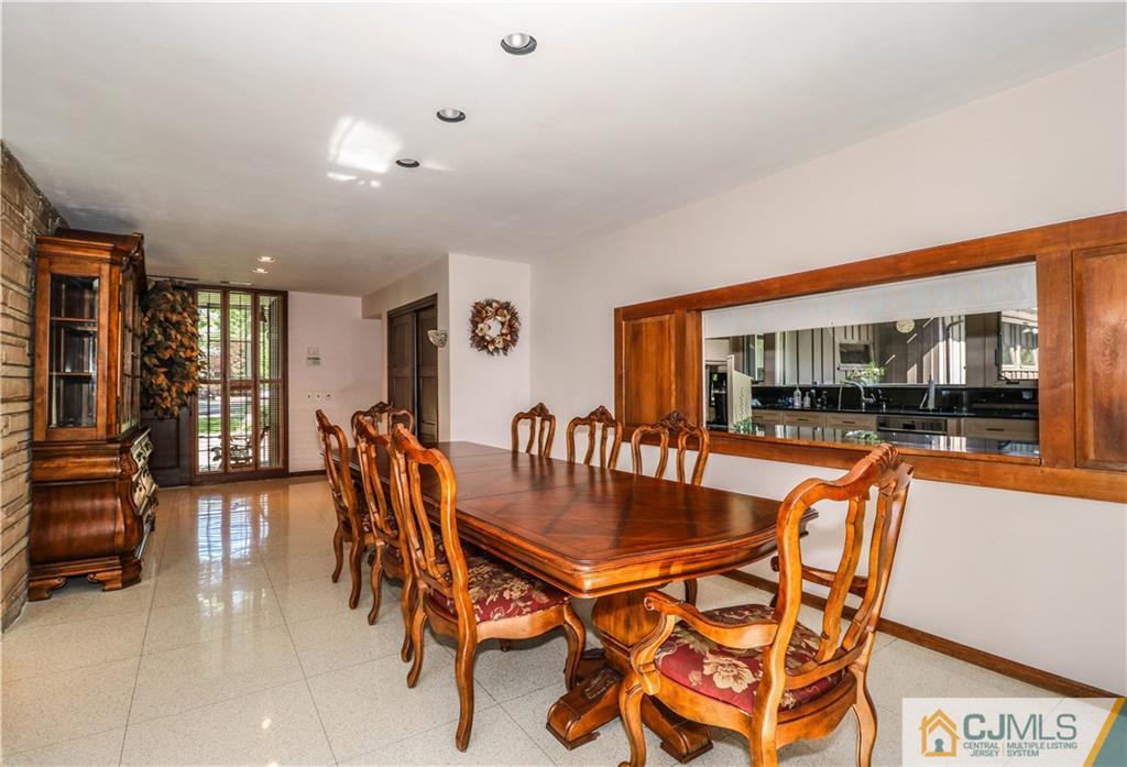 45 Sherwood Road Colonia, NJ 07067 - Photo 4 of 25 a dining room with furniture and wooden floor