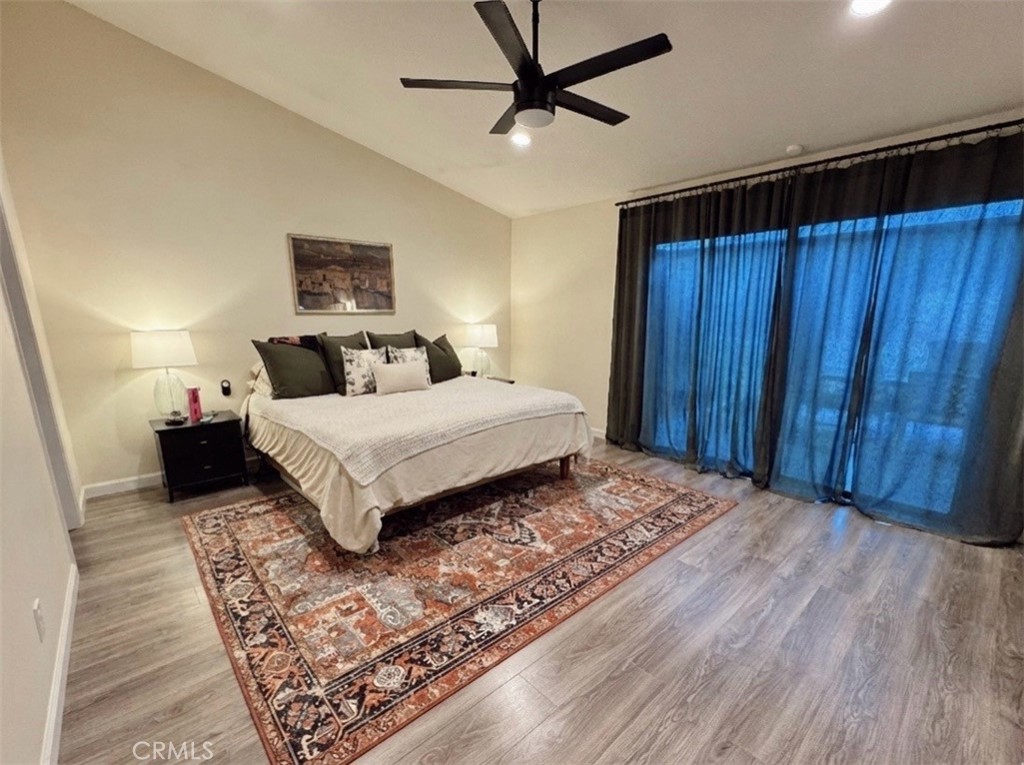 25941 Matel Road Valencia, CA 91355 - Photo 7 of 10 a spacious bedroom with a bed and a dresser