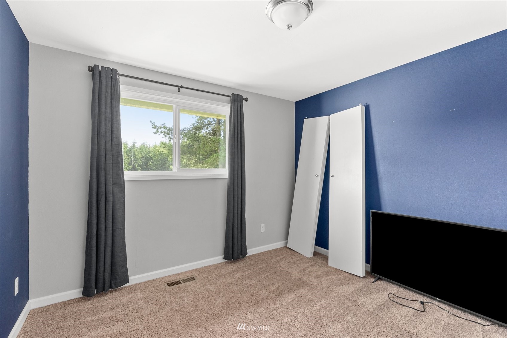 605 West Forest Napavine Road Chehalis, WA 98532 - Photo 15 of 34 a view of an empty room with wooden floor and a window