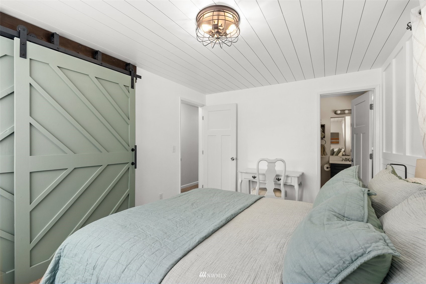 605 West Forest Napavine Road Chehalis, WA 98532 - Photo 19 of 34 a bedroom with a bed and a chandelier