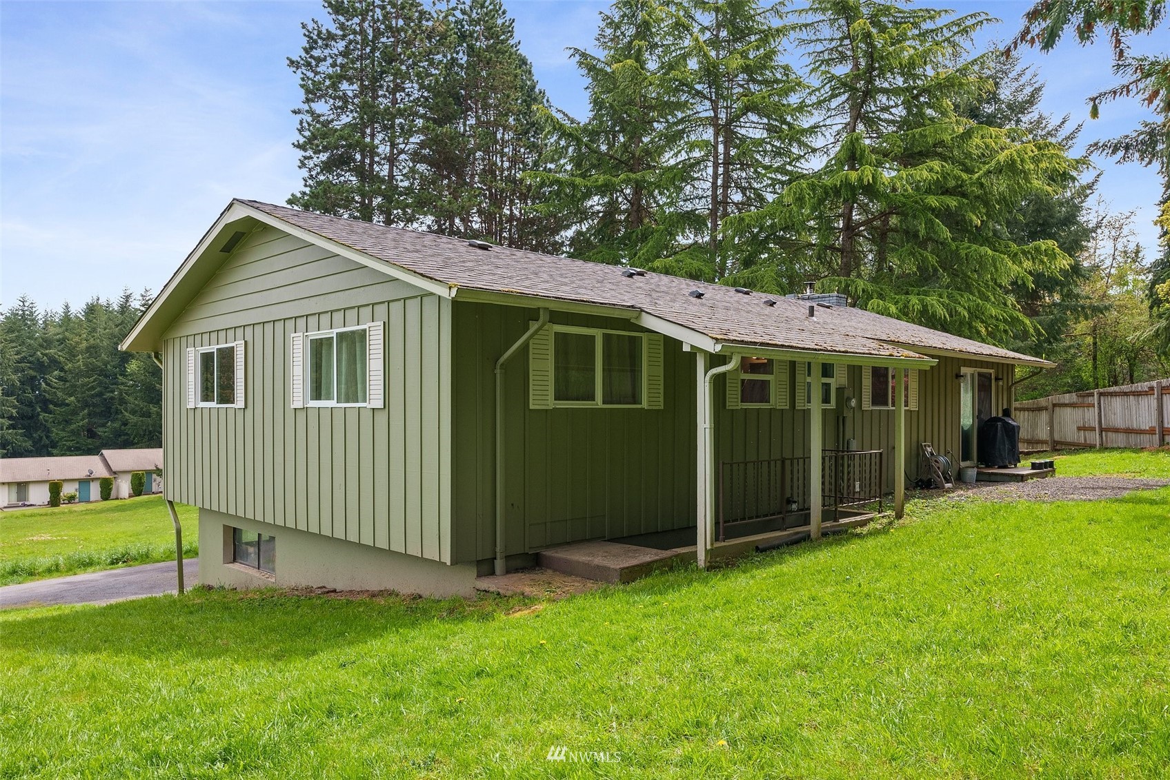 605 West Forest Napavine Road Chehalis, WA 98532 - Photo 27 of 34 a view of a house with a yard potted plants and a large tree