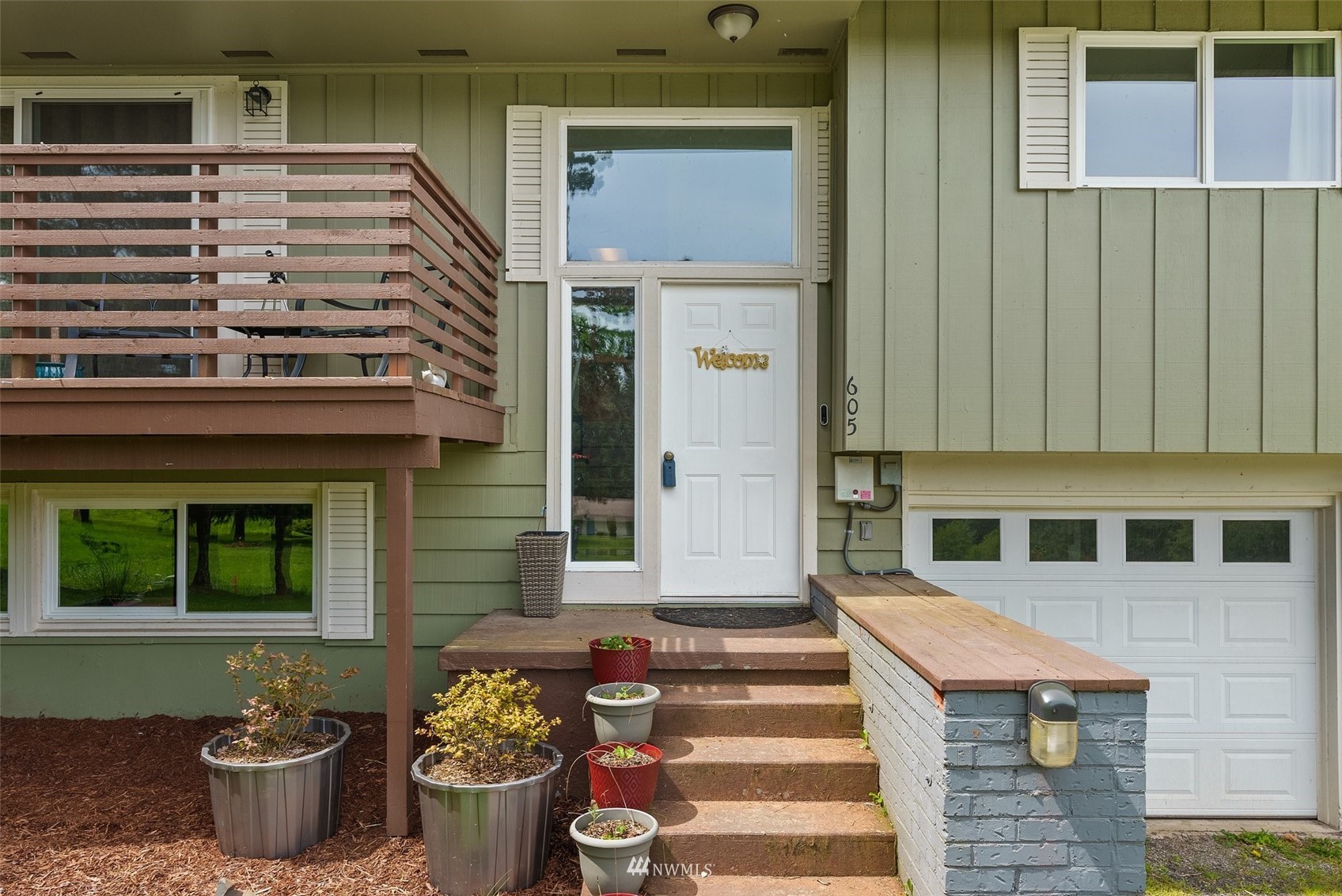 605 West Forest Napavine Road Chehalis, WA 98532 - Photo 5 of 34 a front view of a house with outdoor seating and plants