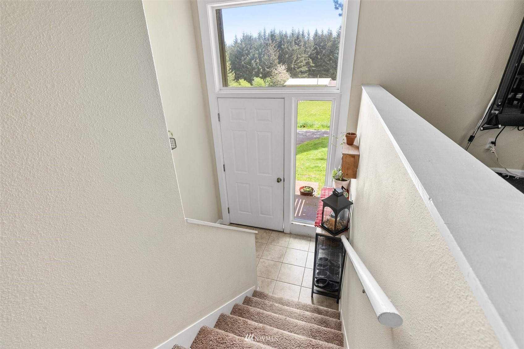 605 West Forest Napavine Road Chehalis, WA 98532 - Photo 7 of 34 a view of a hallway with wooden floor and staircase