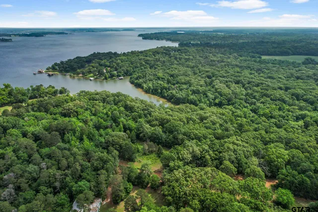 a view of a lake with a yard