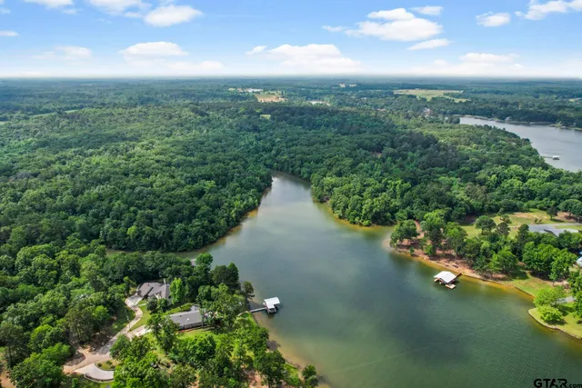 an aerial view of a house with yard