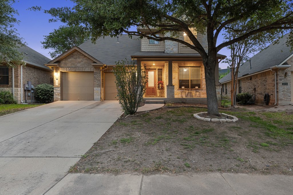 10800 Desert Willow Loop Austin, TX 78748 - Photo 1 of 36 a front view of a house with a yard and garage