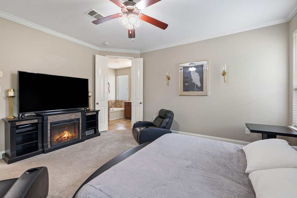 10800 Desert Willow Loop Austin, TX 78748 - Photo 17 of 36 a living room with furniture and a flat screen tv