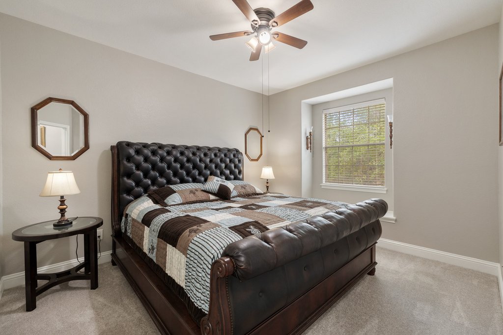 10800 Desert Willow Loop Austin, TX 78748 - Photo 25 of 36 a bedroom with bed and a window