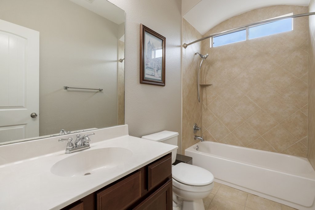 10800 Desert Willow Loop Austin, TX 78748 - Photo 26 of 36 a bathroom with a sink a toilet and shower