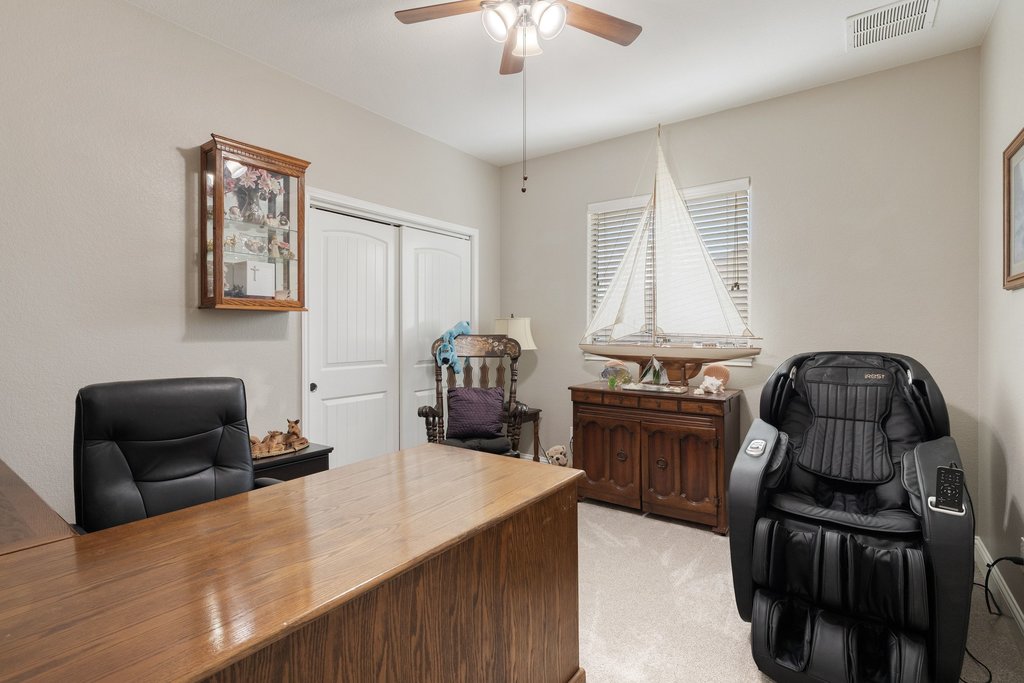 10800 Desert Willow Loop Austin, TX 78748 - Photo 28 of 36 a kitchen with a stove and a refrigerator