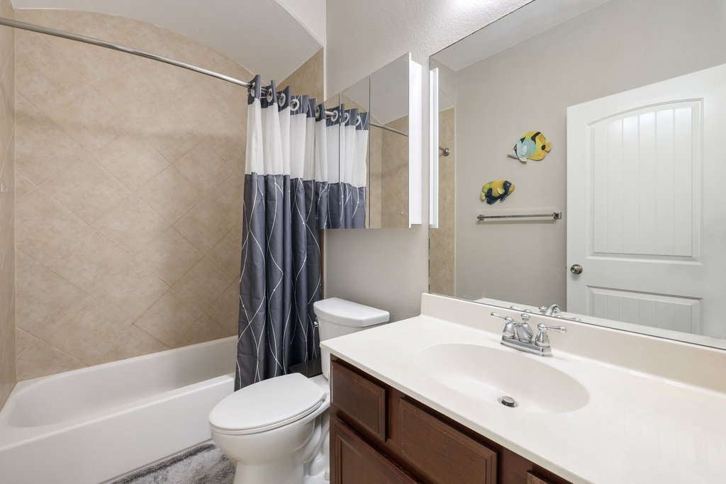 10800 Desert Willow Loop Austin, TX 78748 - Photo 29 of 36 a bathroom with a sink toilet and shower