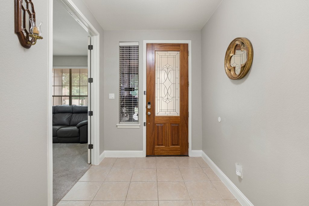 10800 Desert Willow Loop Austin, TX 78748 - Photo 3 of 36 a view of a hallway with entryway and a workspace