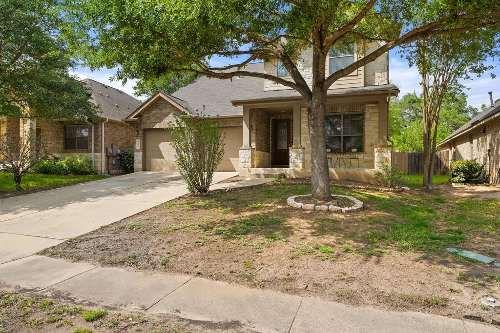 10800 Desert Willow Loop Austin, TX 78748 - Photo 32 of 36 a view of a house with a small yard and large tree
