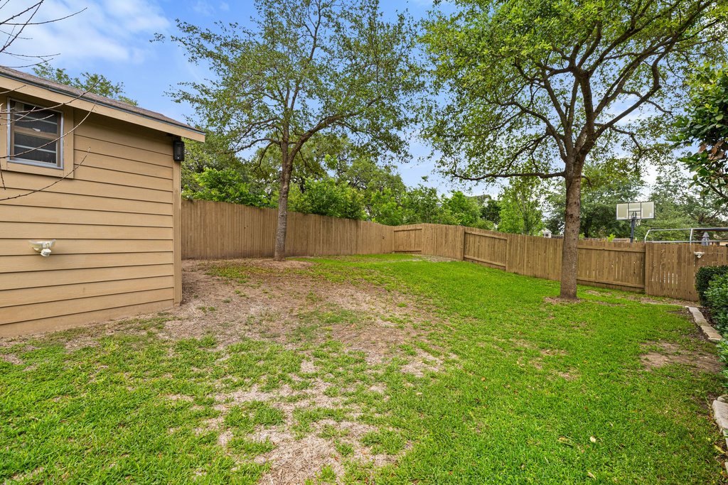 10800 Desert Willow Loop Austin, TX 78748 - Photo 33 of 36 a backyard of a house with lots of green space