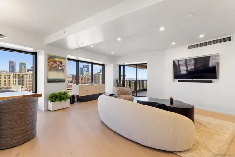 a bedroom with a bed and large window