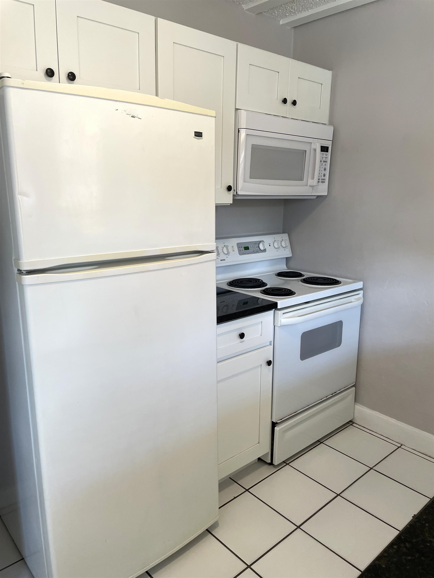 147 D Riberia Street St. Augustine, FL 32084 - Photo 2 of 9 a white refrigerator freezer sitting inside of a kitchen