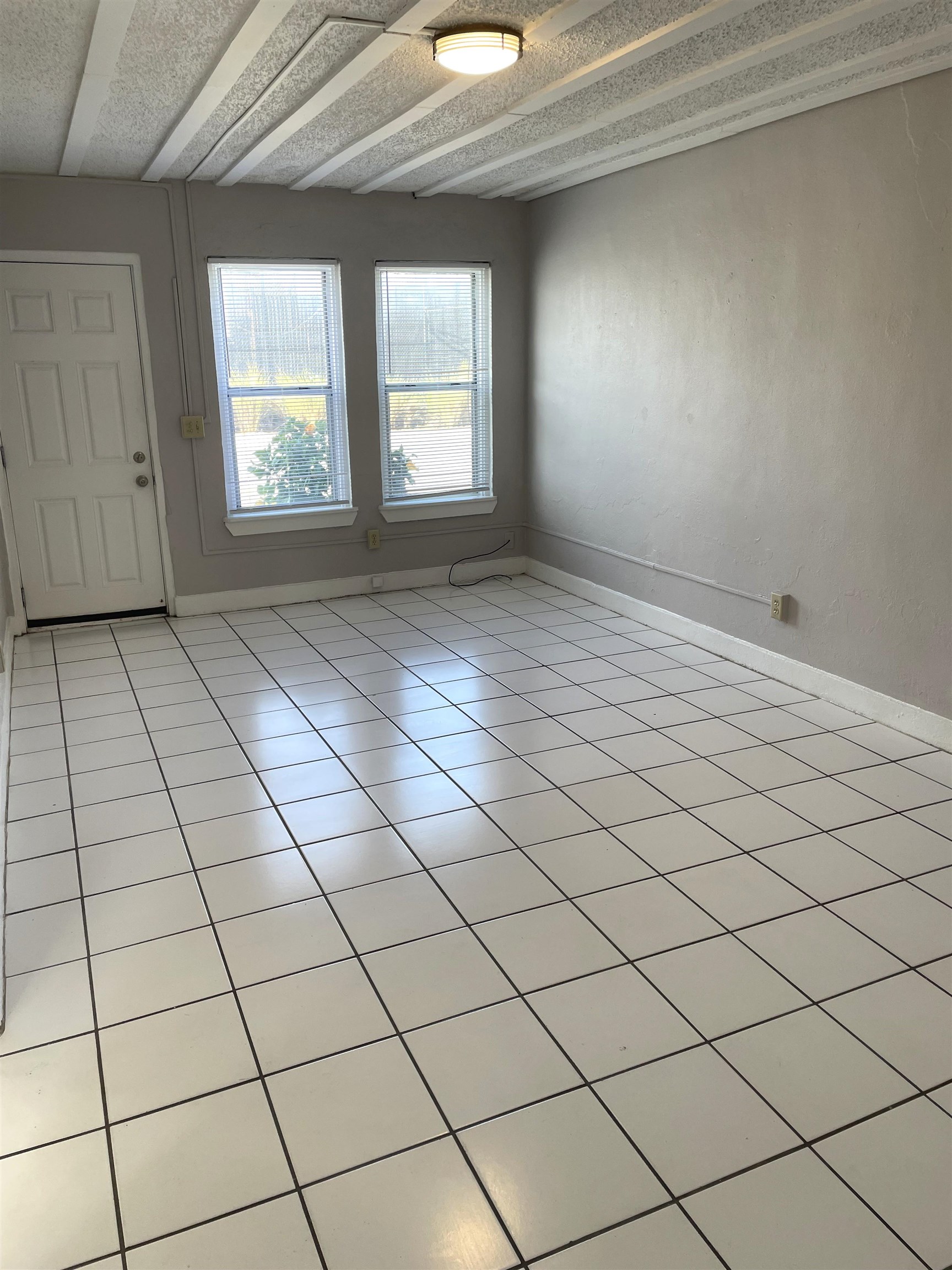 147 D Riberia Street St. Augustine, FL 32084 - Photo 3 of 9 an empty room with windows