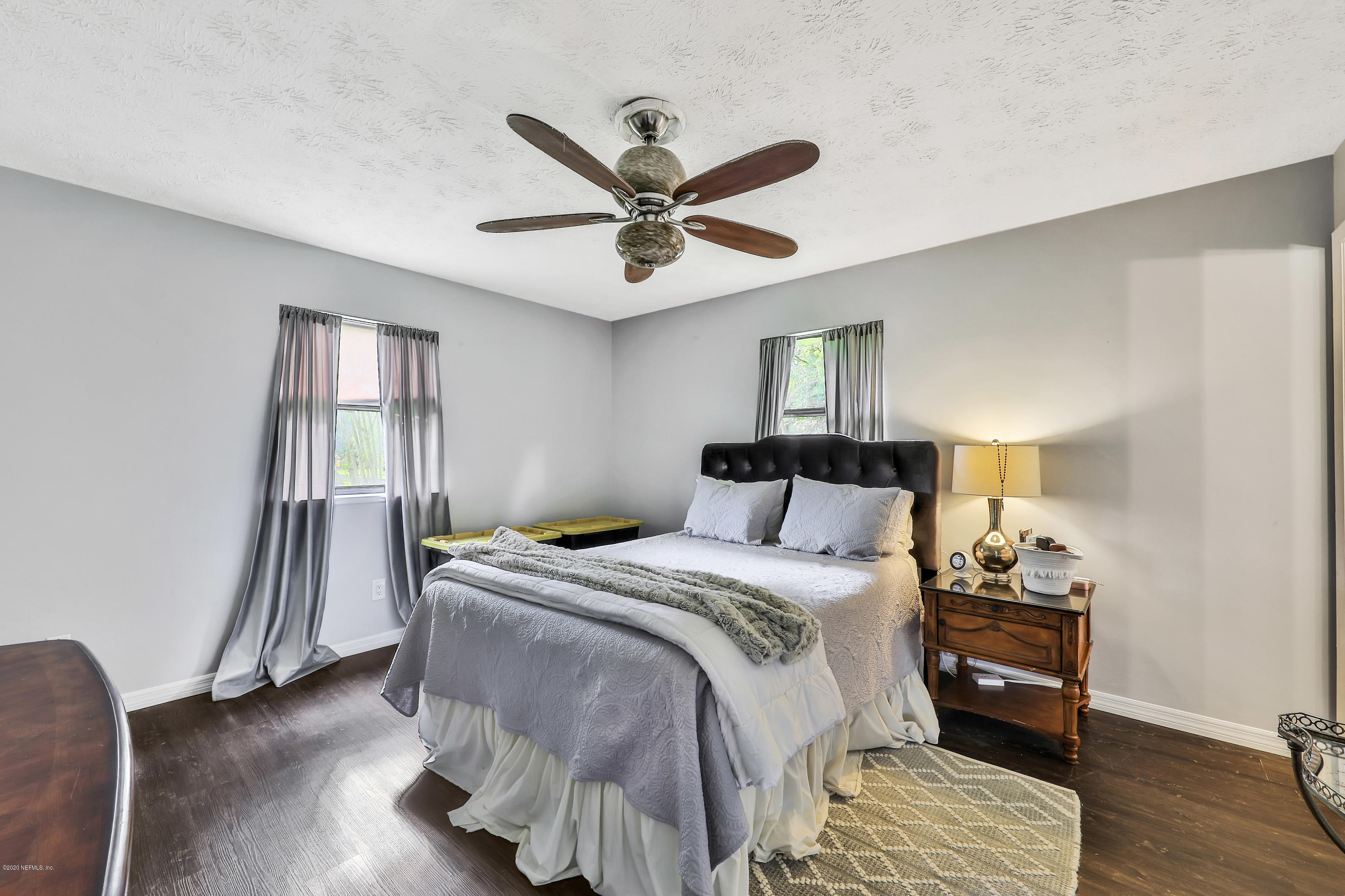 54668 Dornbush Road Callahan, FL 32011 - Photo 12 of 22 a bedroom with a bed and wooden floor