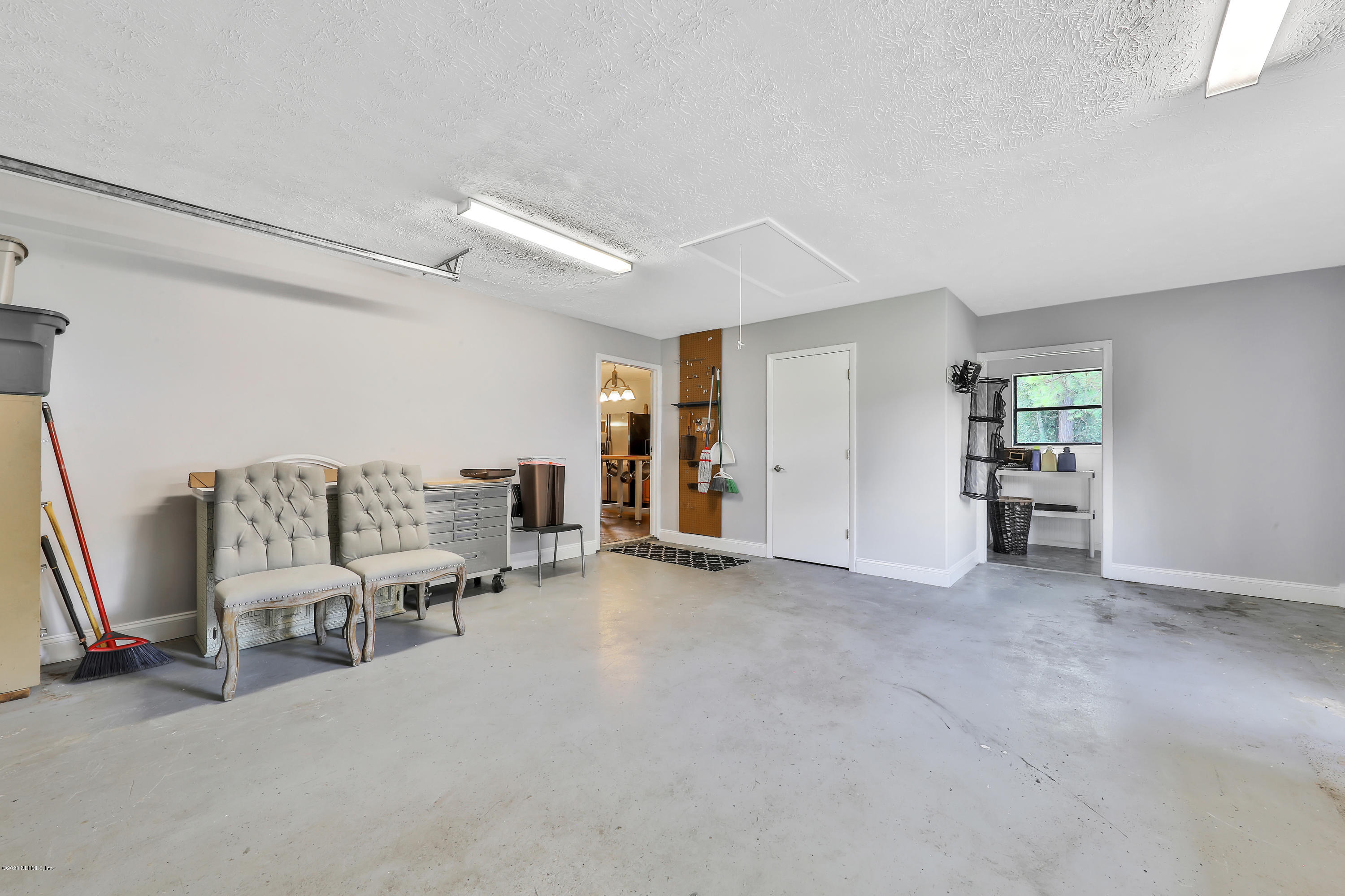 54668 Dornbush Road Callahan, FL 32011 - Photo 22 of 22 a view of a livingroom with furniture and a flat screen tv