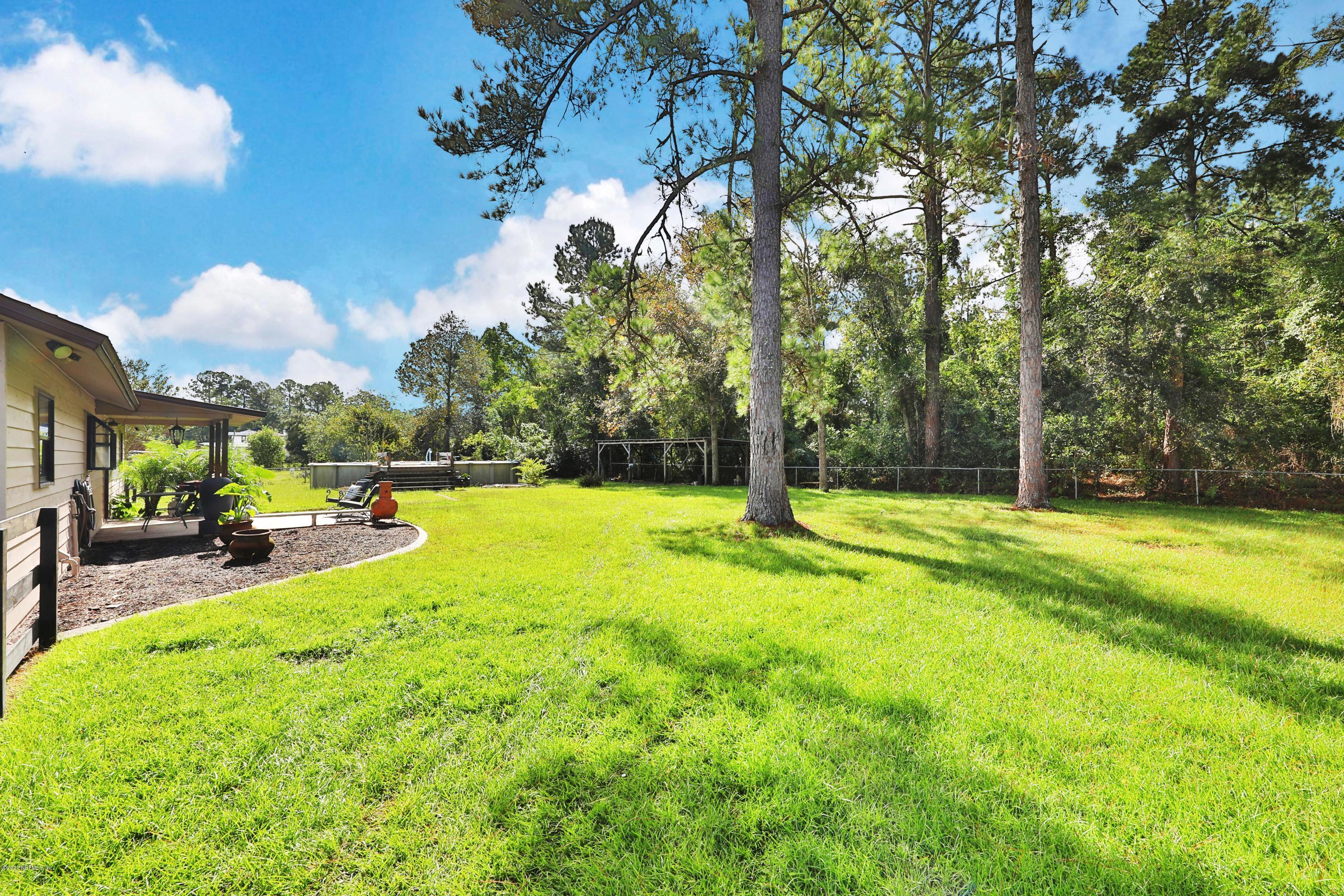 54668 Dornbush Road Callahan, FL 32011 - Photo 4 of 22 a view of backyard with swimming pool