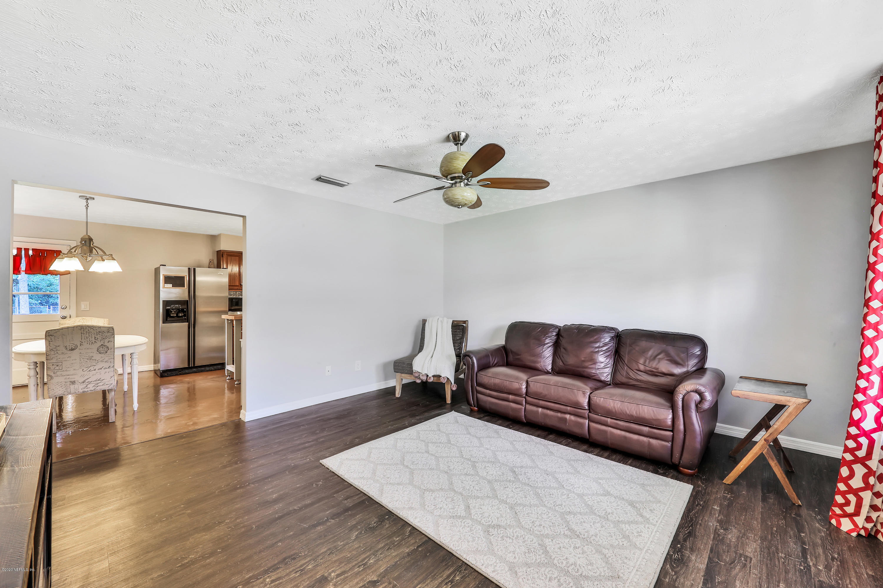 54668 Dornbush Road Callahan, FL 32011 - Photo 8 of 22 a living room with furniture and a wooden floor