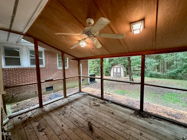 a view of a porch with wooden floor and outdoor space